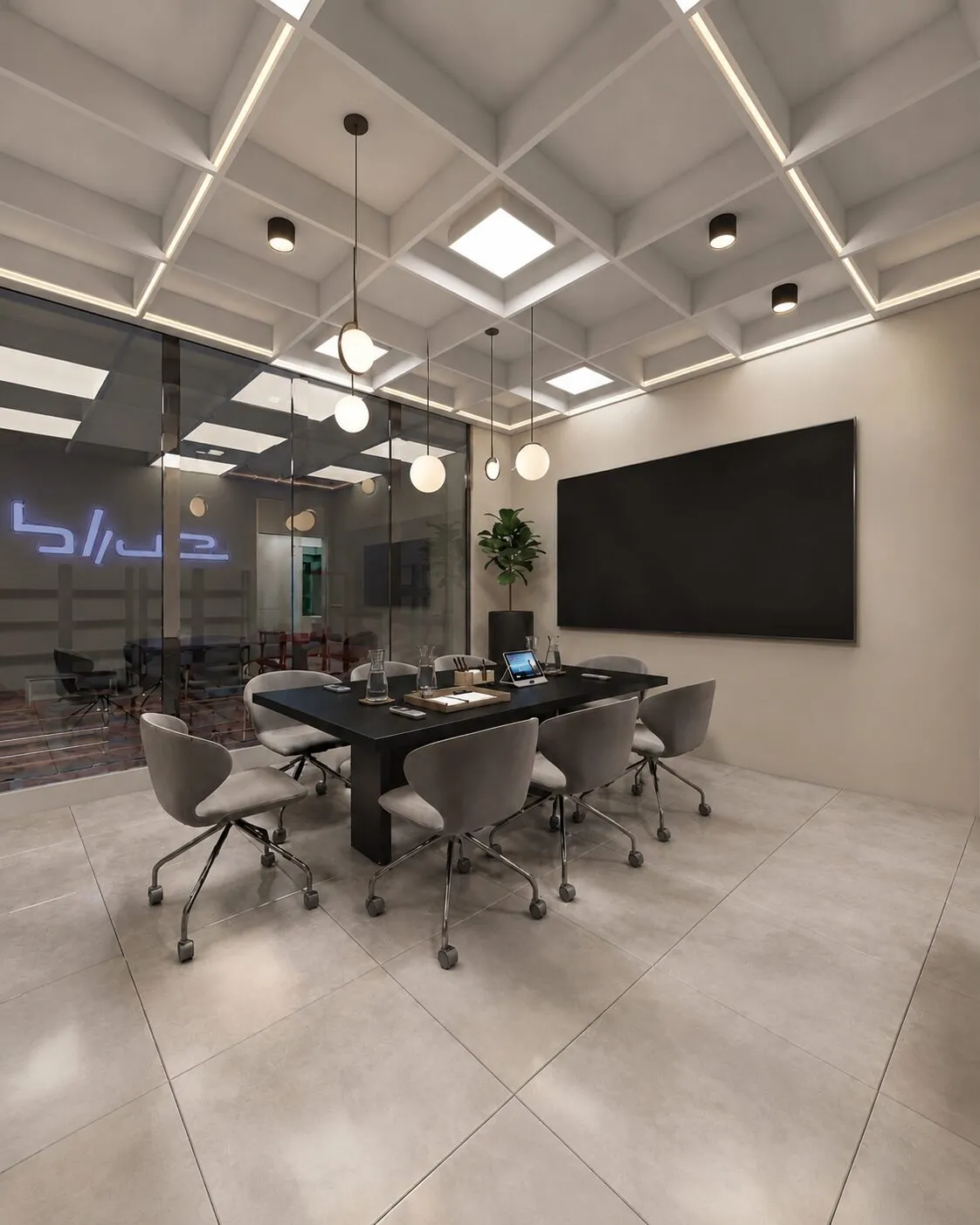 Meeting room with a long black table, grey chairs, a wall screen and backlit company logo.